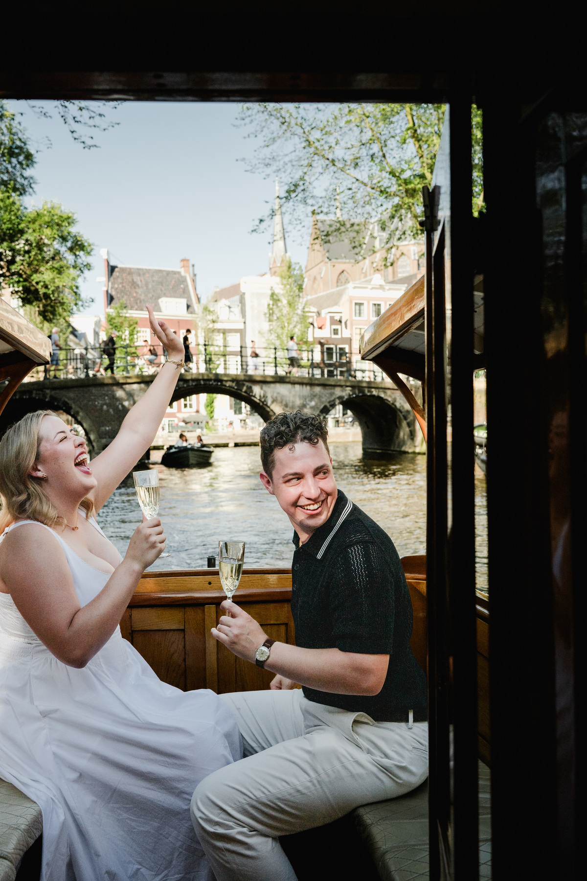 Woman reacting to a surprise canal boat proposal