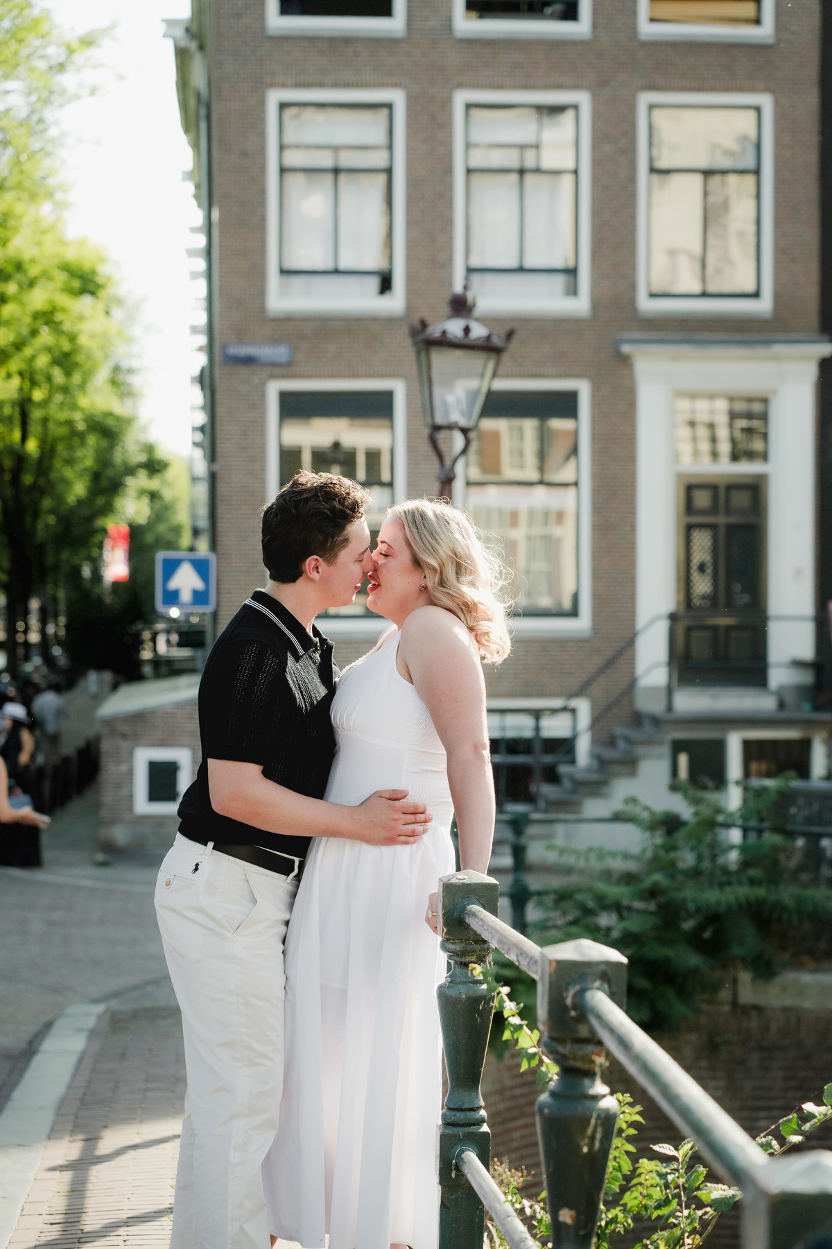 Natural engagement portrait beside an Amsterdam bridge