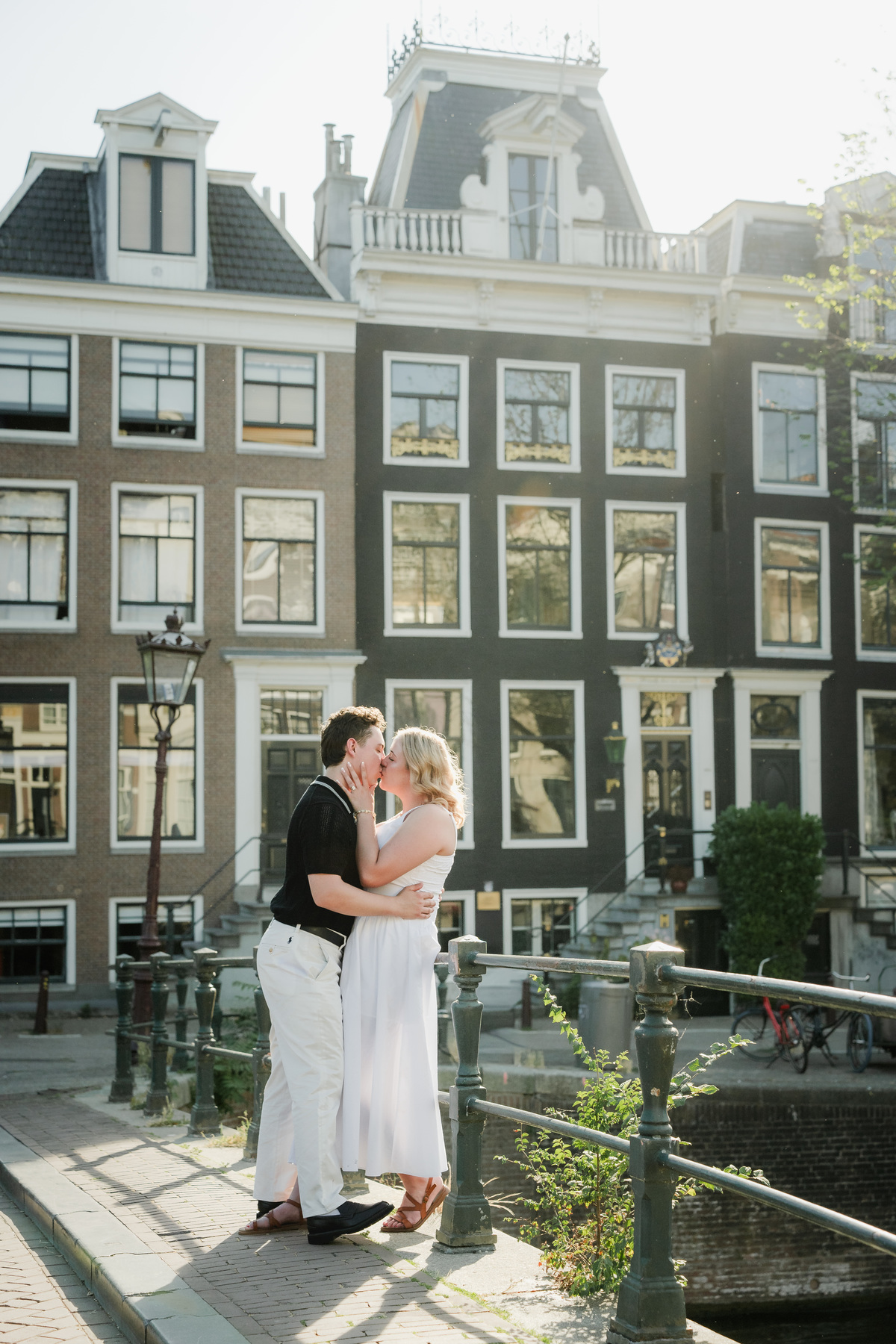 Natural engagement portrait beside an Amsterdam bridge