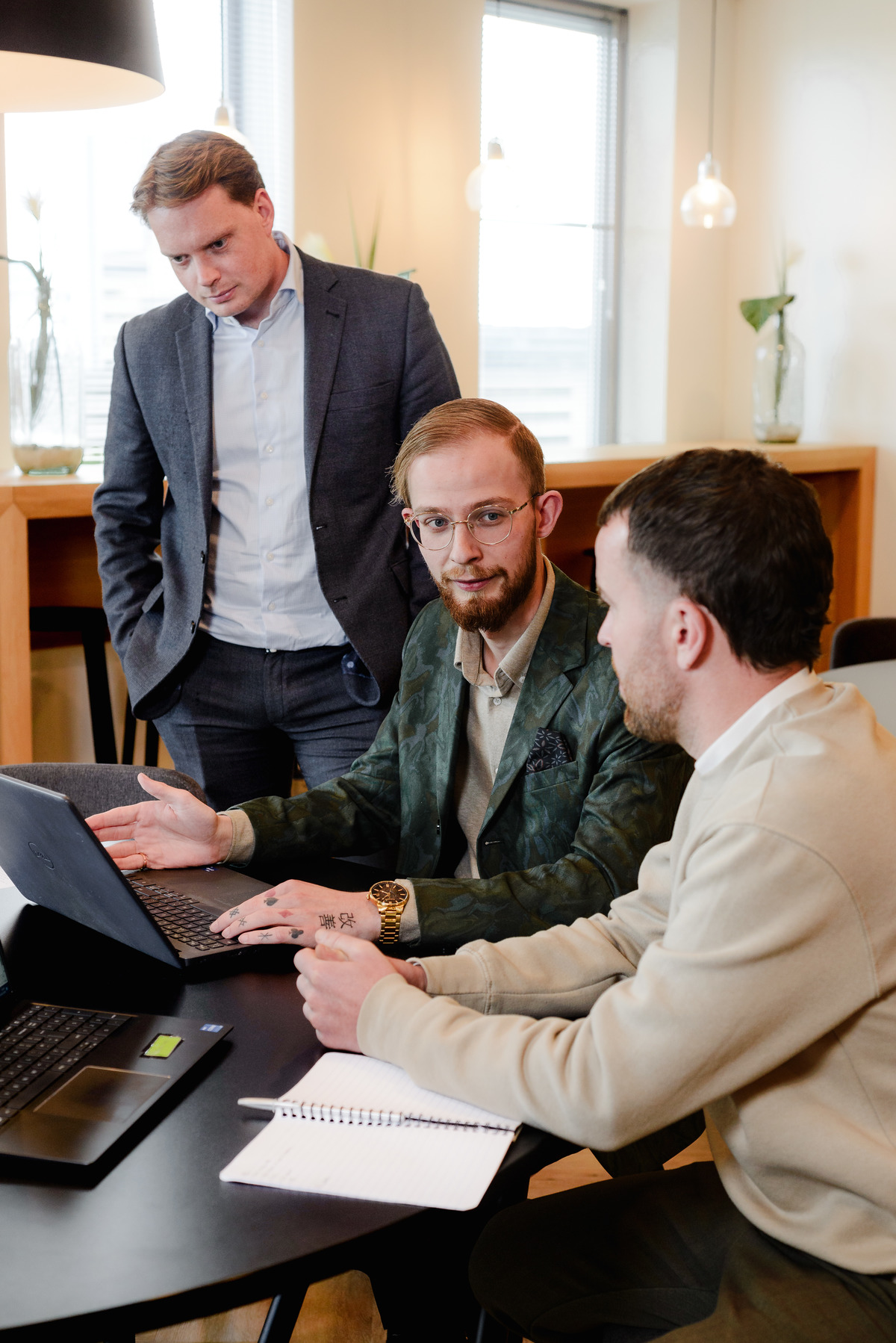 Three colleagues working together during a corporate office photography session in Amsterdam