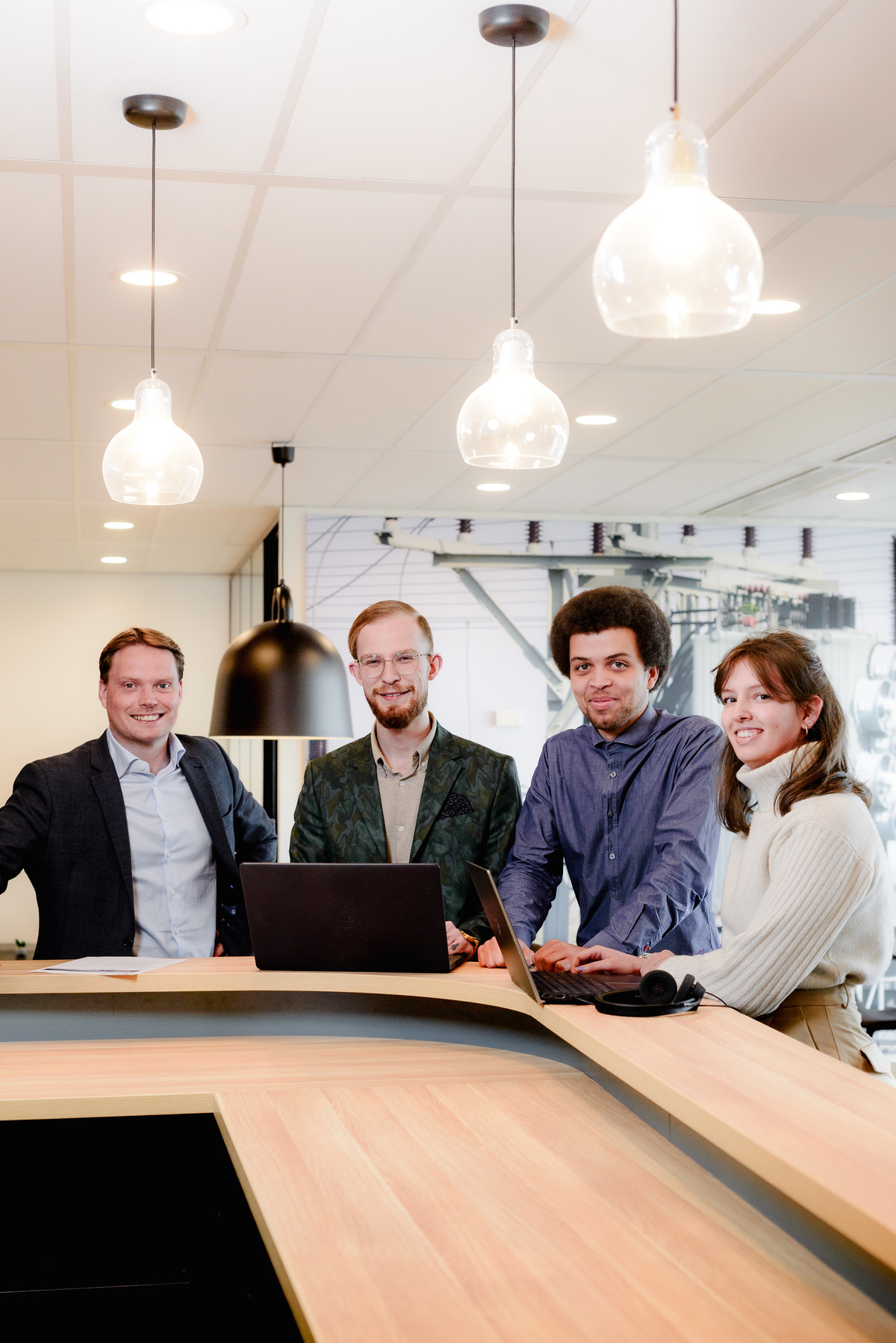 Vertical corporate team portrait of colleagues together in their Amsterdam workplace