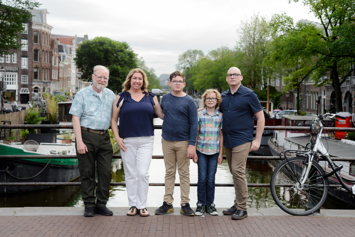 Family relaxing together during an Amsterdam vacation photoshoot