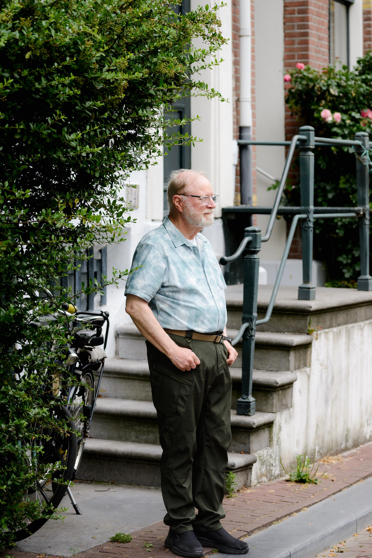 Grandfather walks in Amsterdam during a photo session in the Jordaan area. 