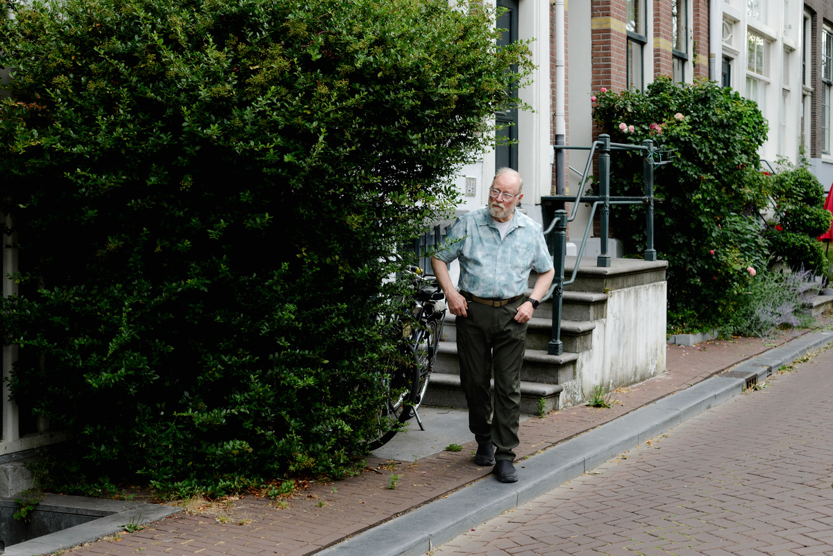 Grandfather walks in Amsterdam during a photo session in the Jordaan area. 