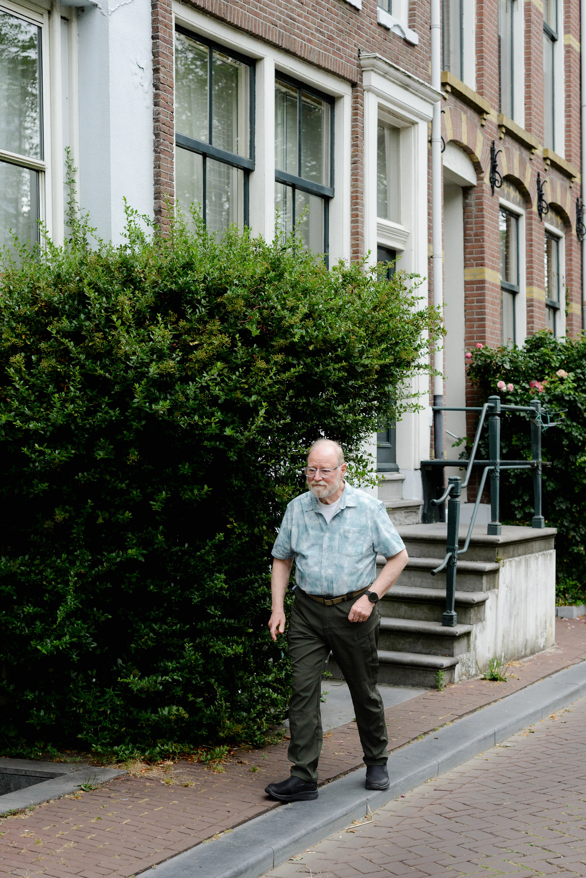Grandfather walks in Amsterdam during a photo session in the Jordaan area. 
