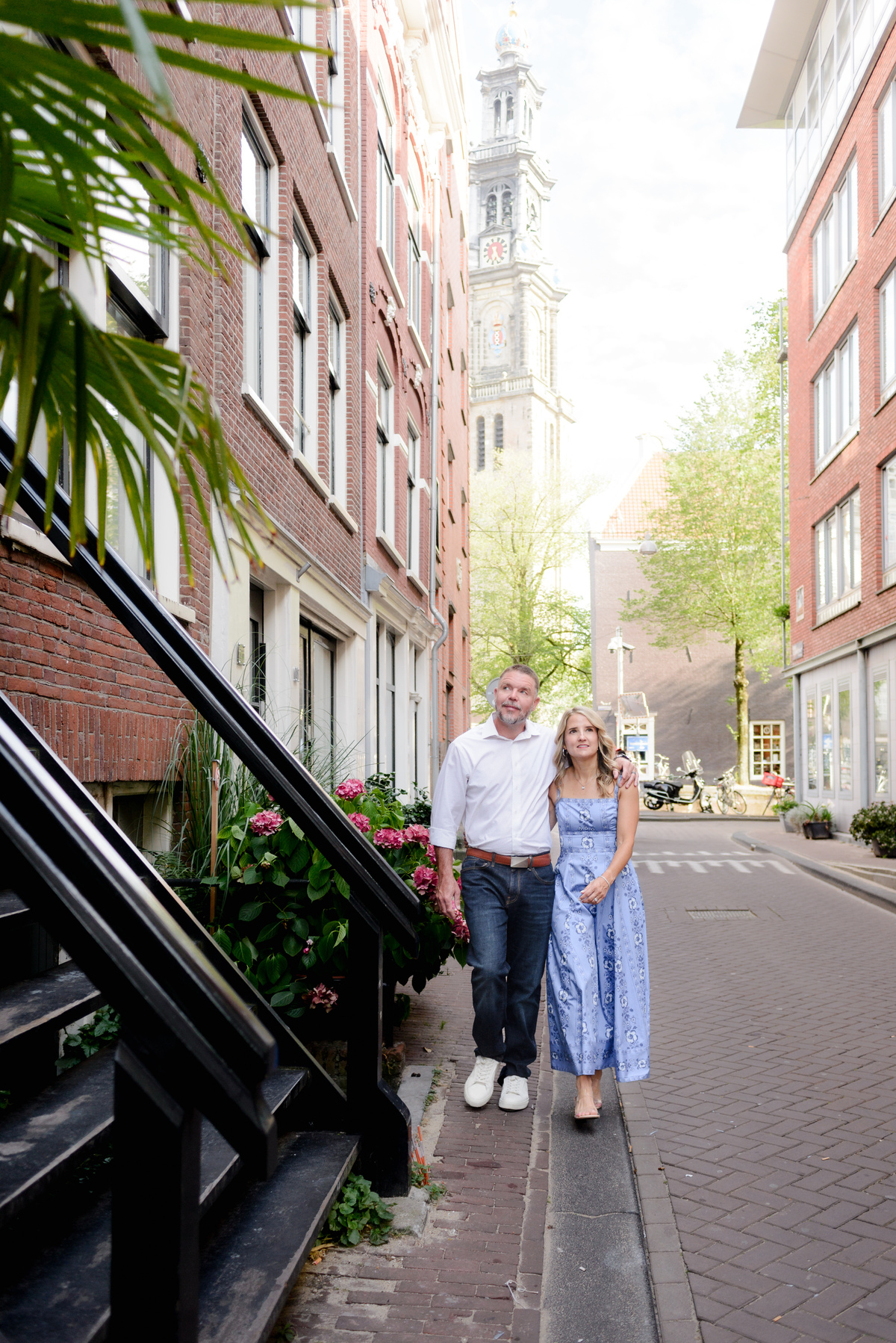 Couple walking together through a narrow Amsterdam street