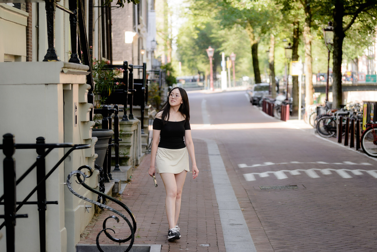 Natural solo travel portrait beside the canals in Amsterdam