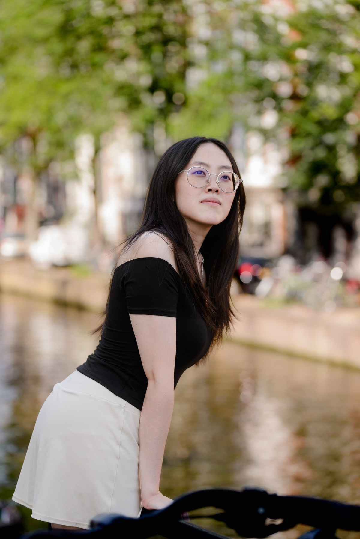 Woman looking across the water during her first Amsterdam photo session