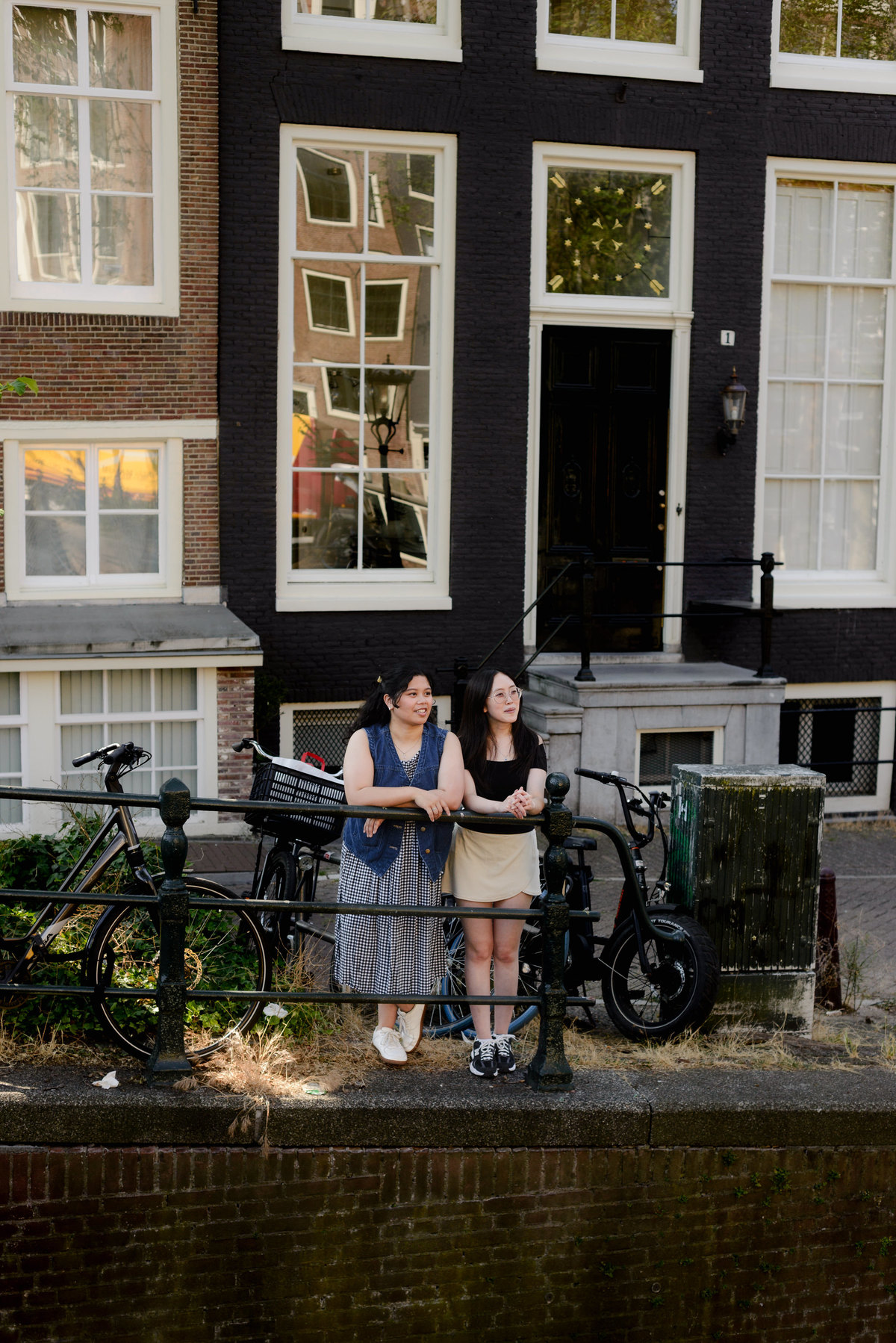 Friends celebrating their first European trip with photographs in Amsterdam