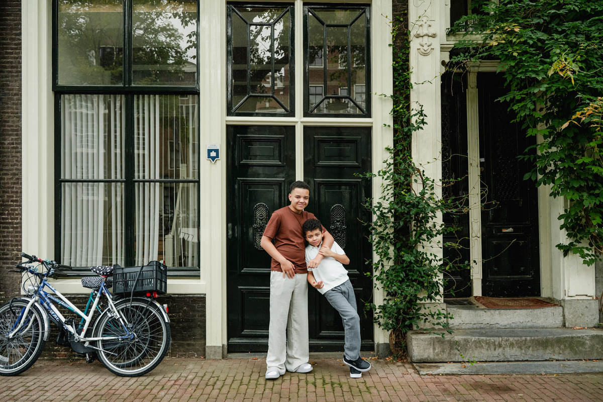 Two brothers playing together on a street in Amsterdam’s Jordaan neighbourhood.