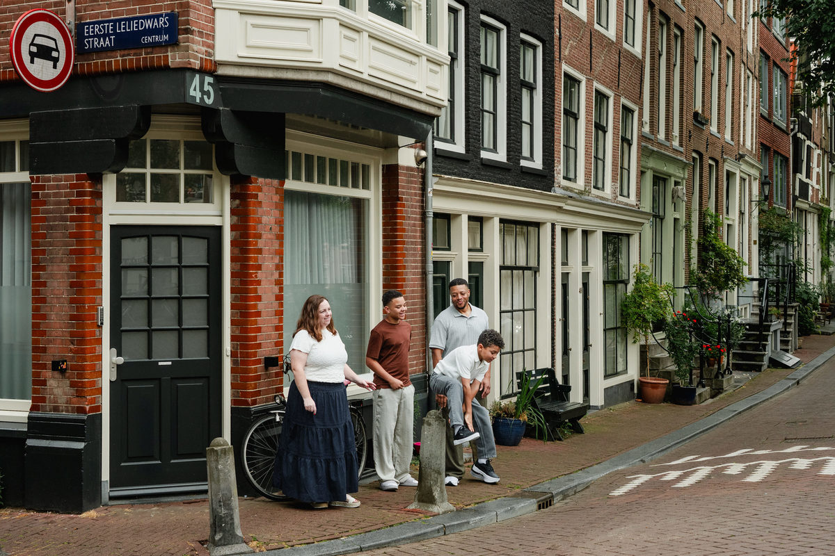 Younger brother mid-jump on a street in the Jordaan, Amsterdam.