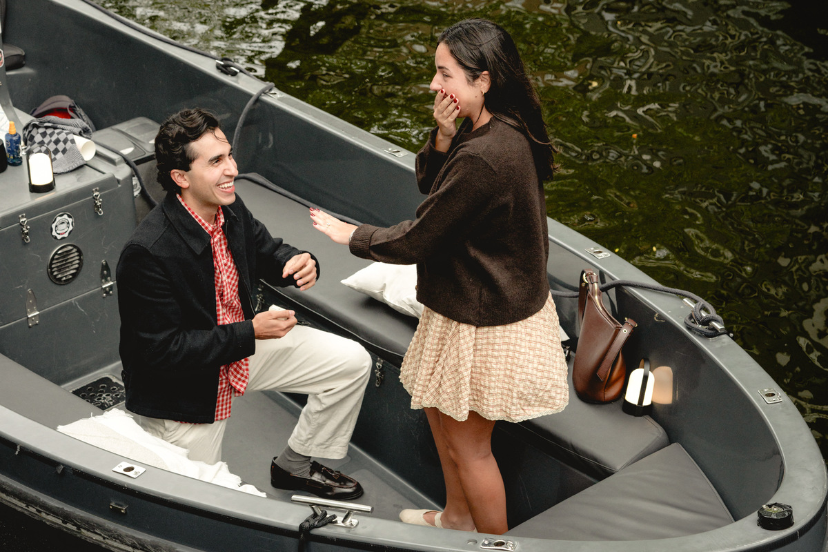 Man proposing to his partner on a private Amsterdam boat
