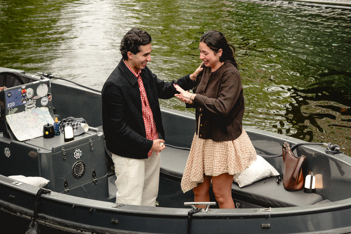 Couple celebrating their engagement on an Amsterdam canal boat.
