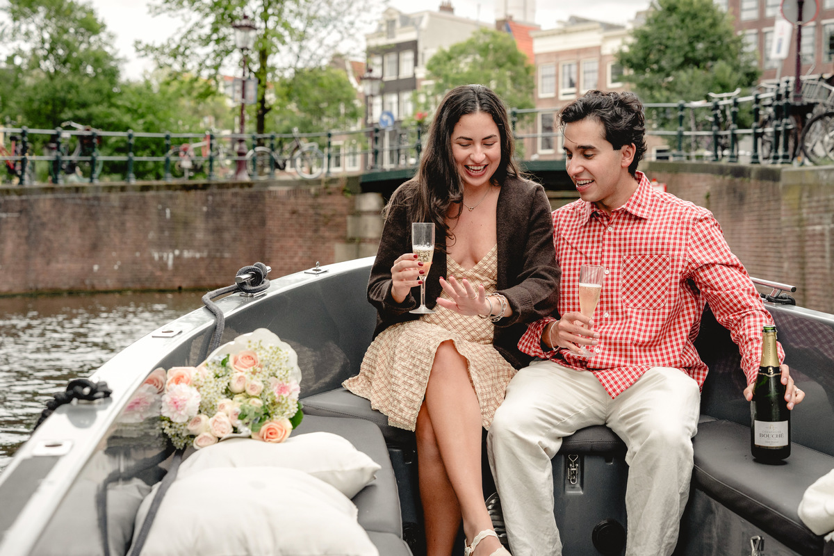 Champagne celebration on a private boat after an engagement proposal.

