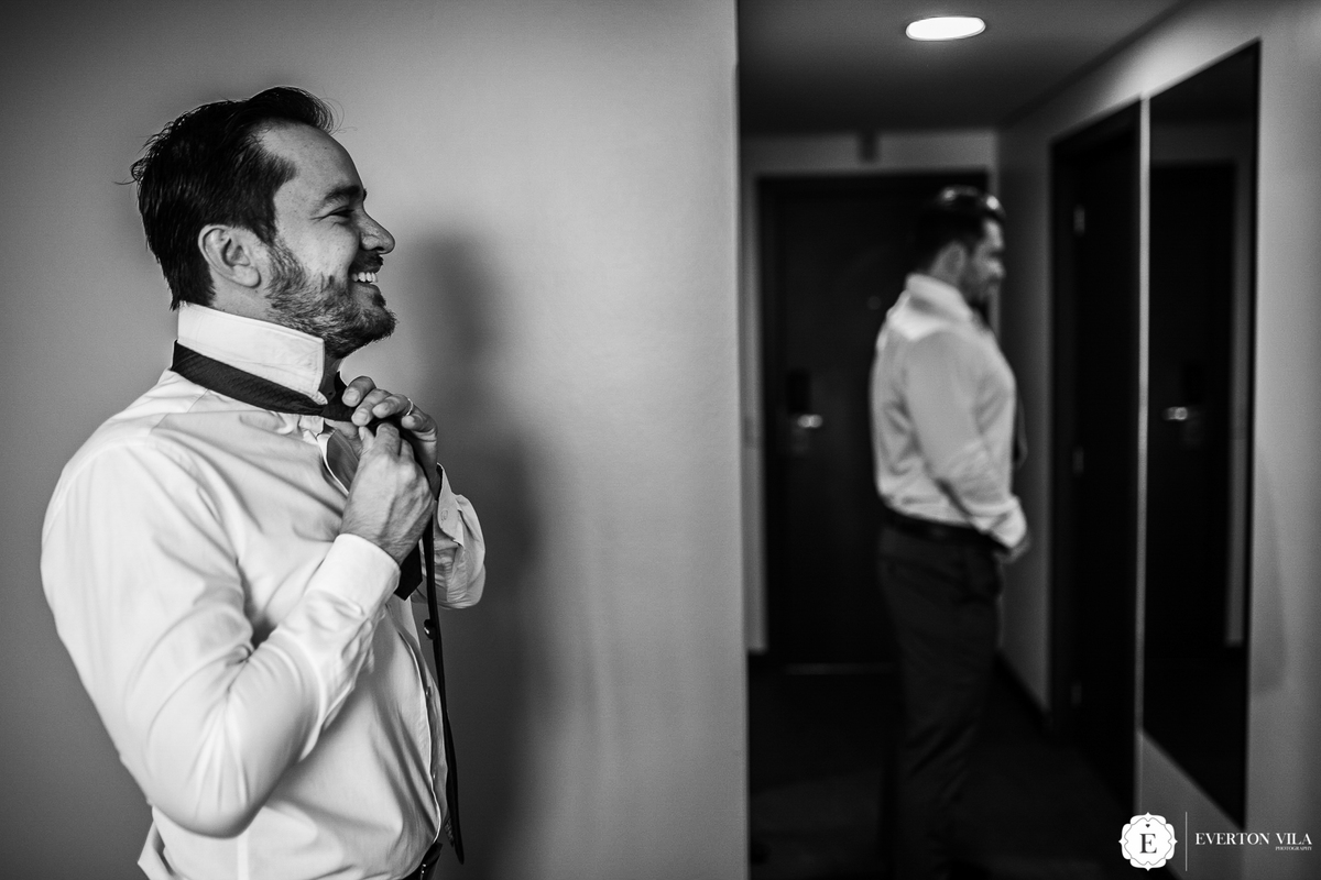 noivo se vestindo com terno classico para seu casamento em maringa