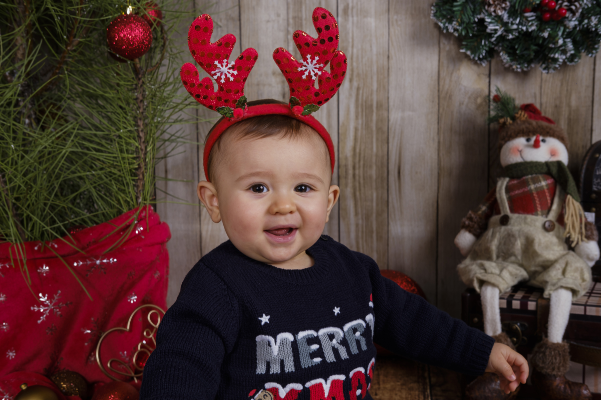 Bebé sessão fotográfica de natal expressivo