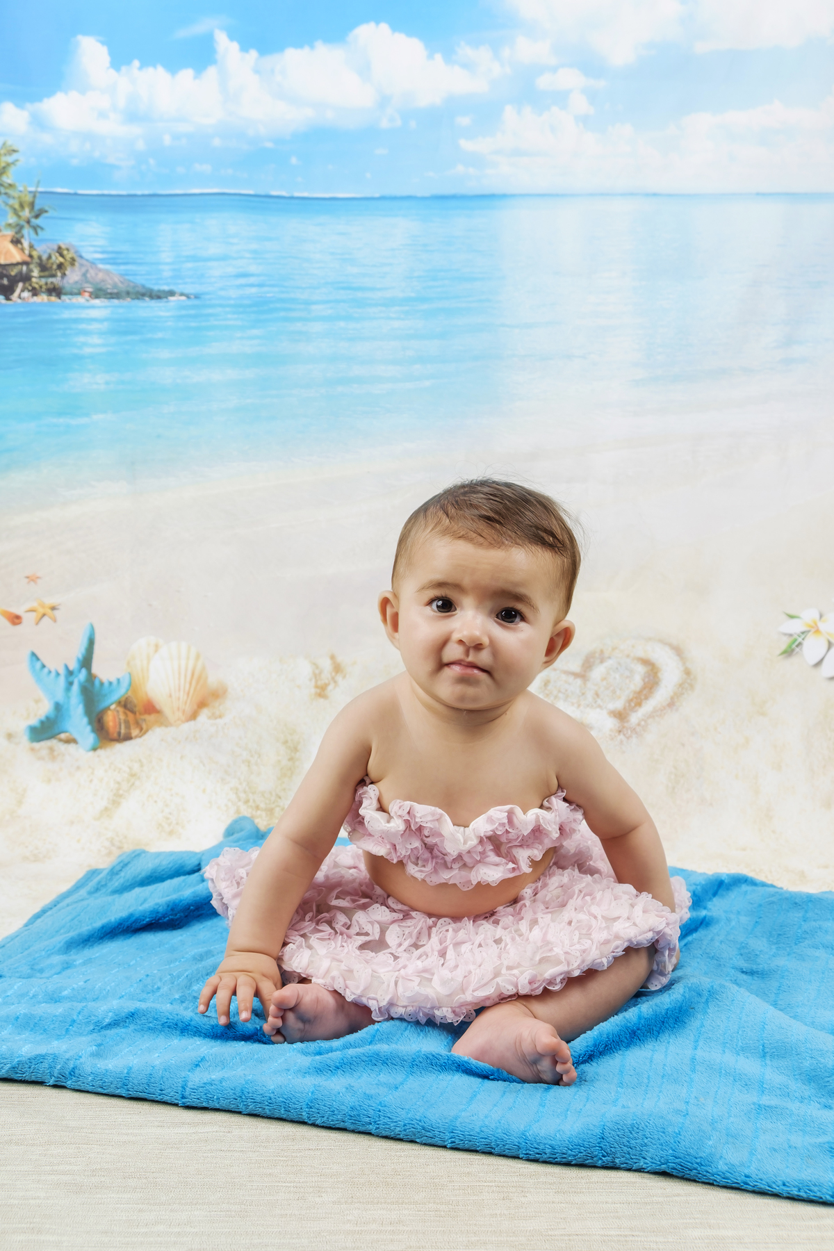 Bebé na sessão fotográfica na praia