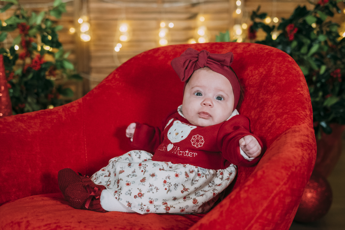 Irmã mais nova na sessão fotográfica de Natal