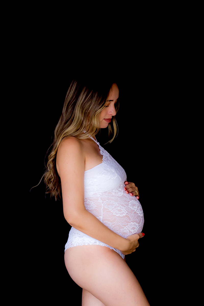 Fotografia de gestante na casa da cliente em Pará de Minas.