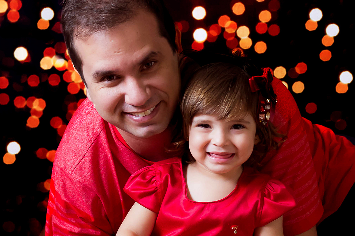 Fotografia infantil de Natal da Maria de dois anos