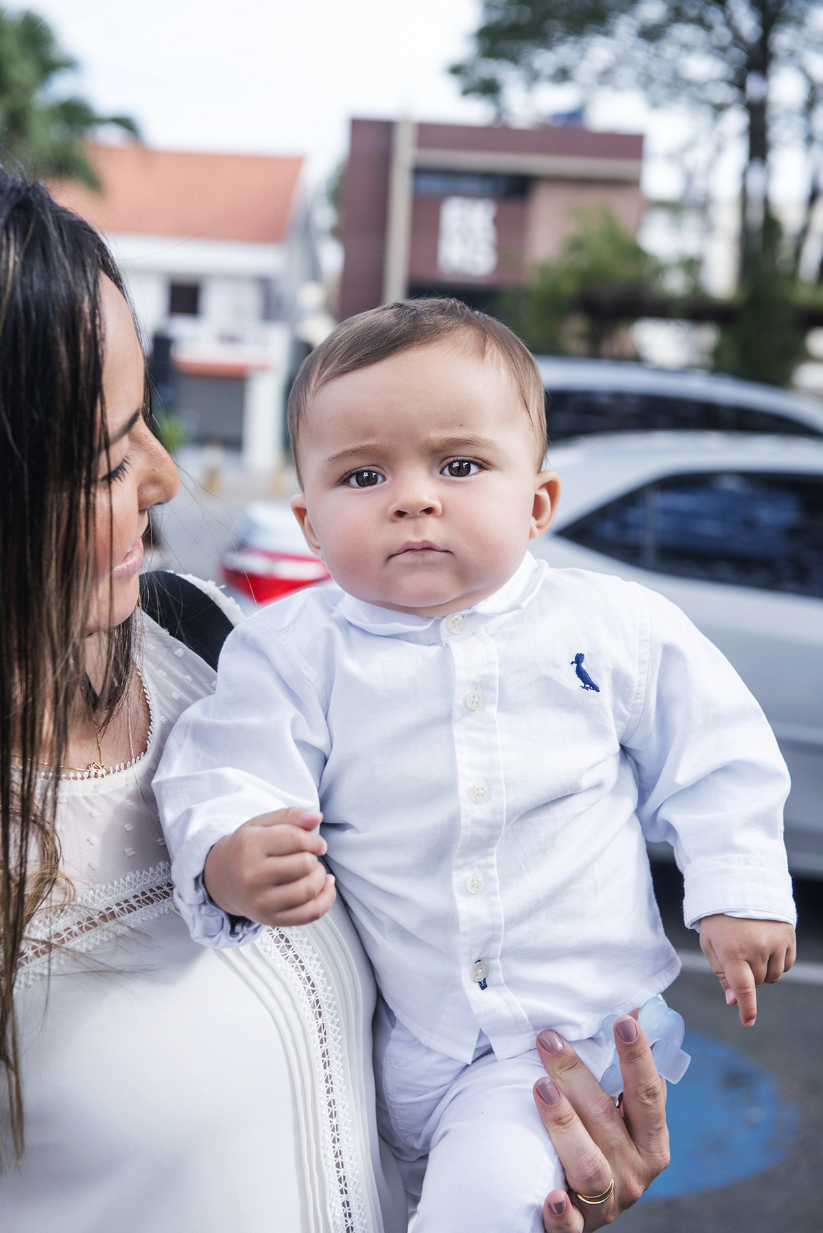 Pedro Augusto no colo da mamãe no dia do seu batizado