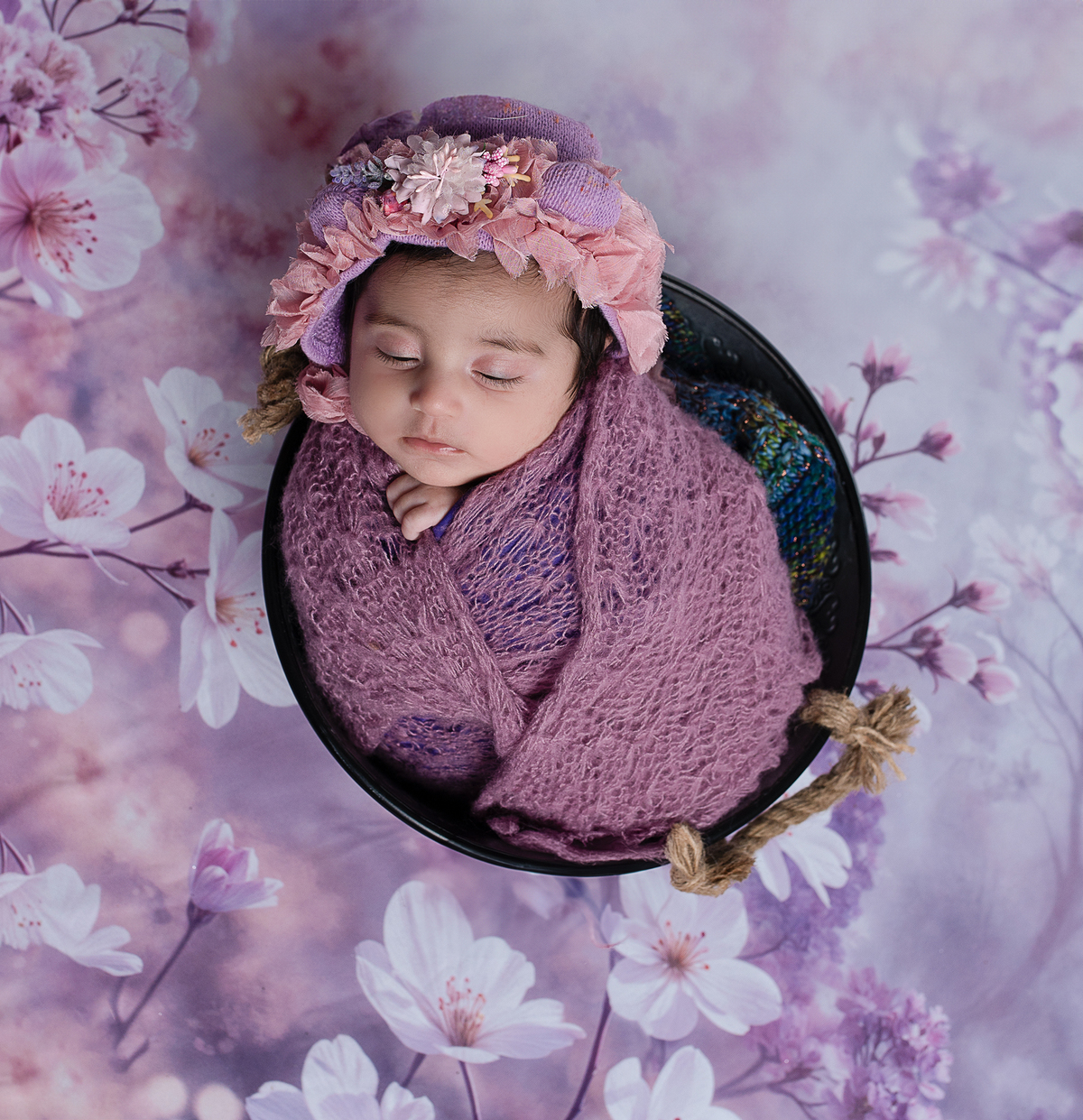 Newborn baby boy posed safely in father’s hands – Burnaby newborn photography studio