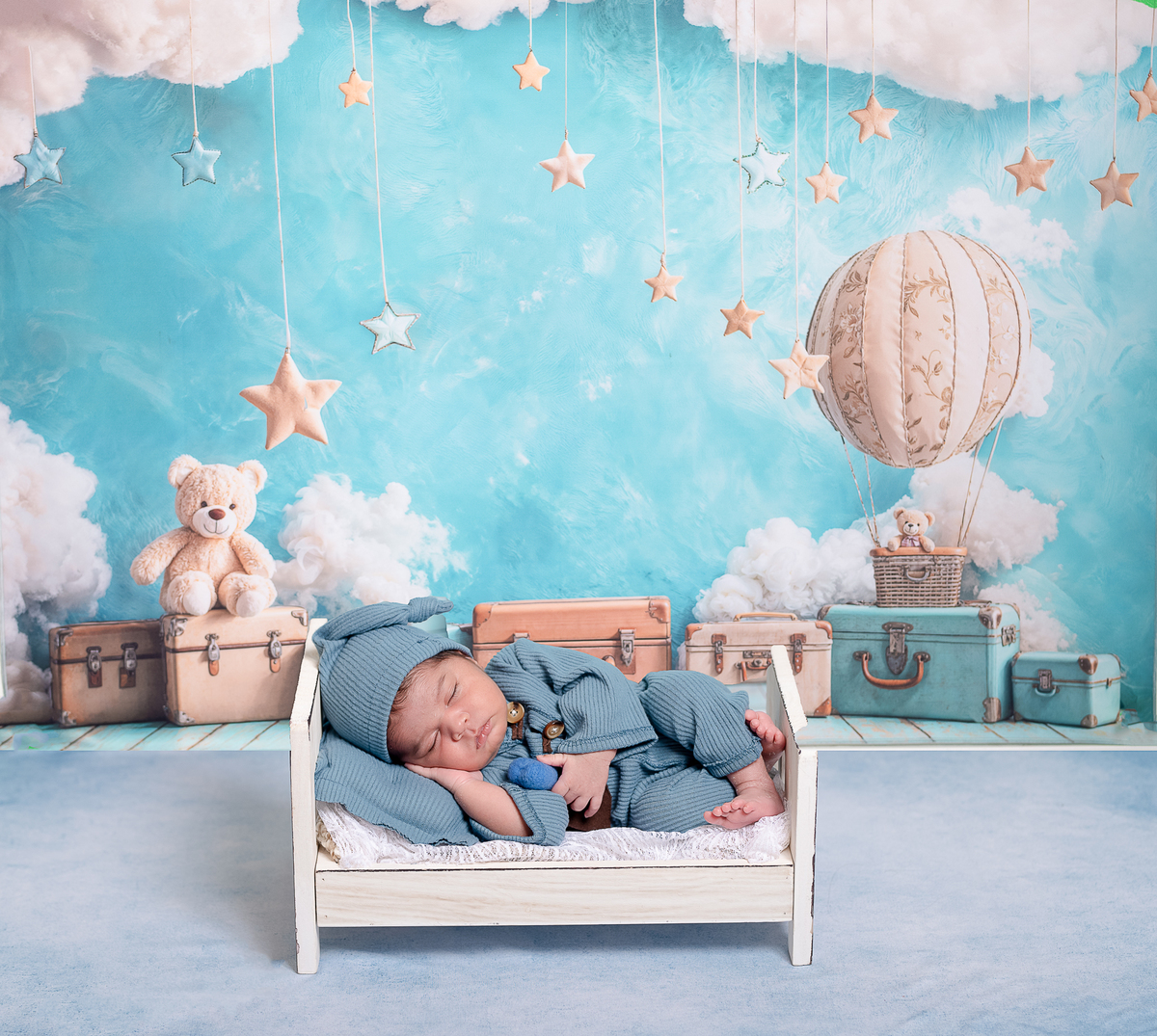 Sleeping newborn baby wrapped in neutral tones – professional newborn session in Vancouver