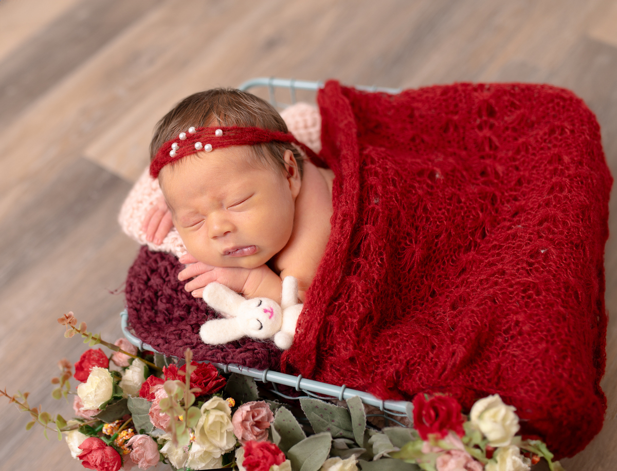 Newborn baby boy posed safely in father’s hands – Burnaby newborn photography studio
