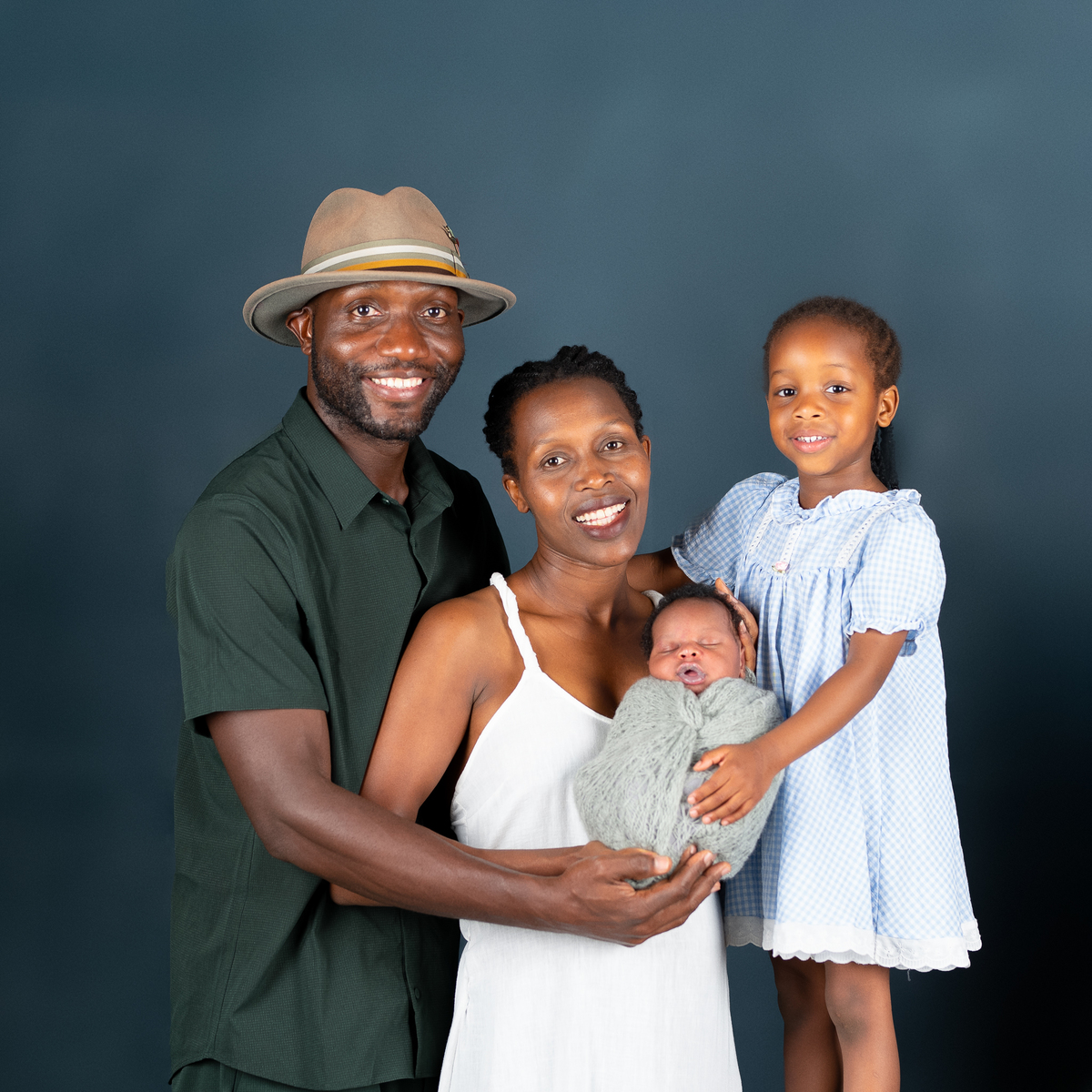 Sleeping newborn baby wrapped in neutral tones – professional newborn session in Vancouver