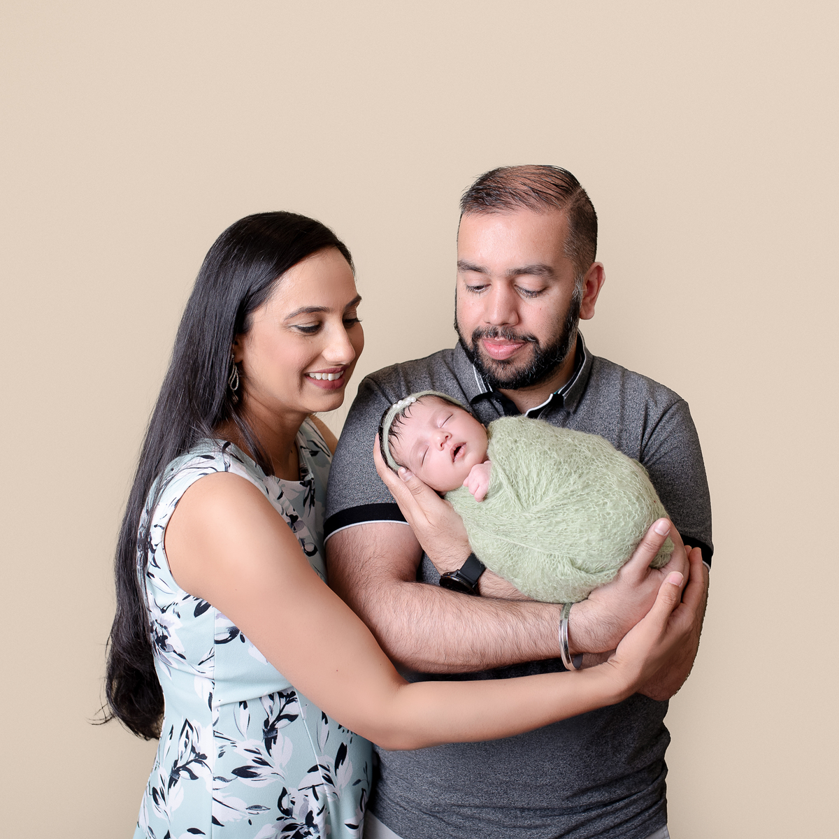 Sleeping newborn baby wrapped in neutral tones – professional newborn session in Vancouver
