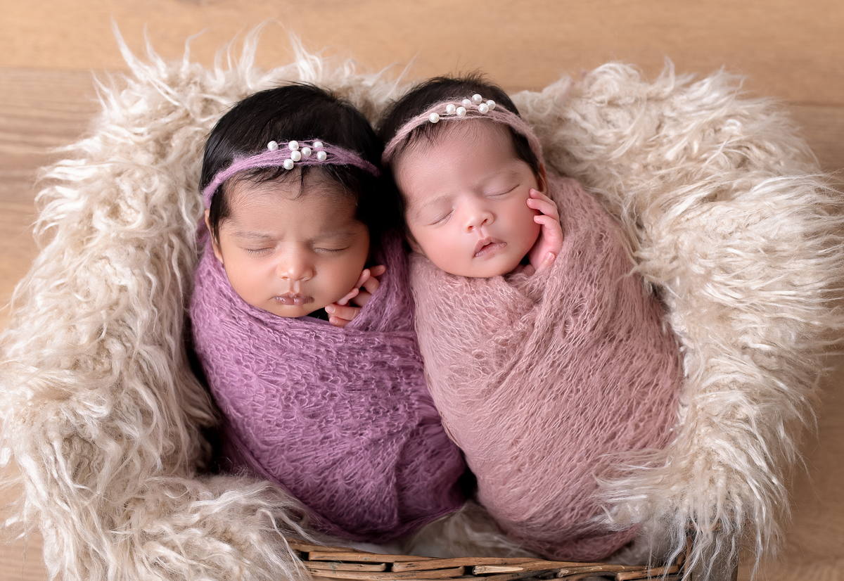 Newborn baby boy posed safely in father’s hands – Burnaby newborn photography studio