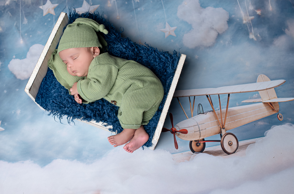 Sleeping newborn baby wrapped in neutral tones – professional newborn session in Vancouver