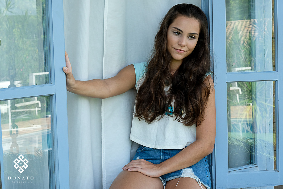 foto feita na janela da casa onde a debutante passa suas férias.