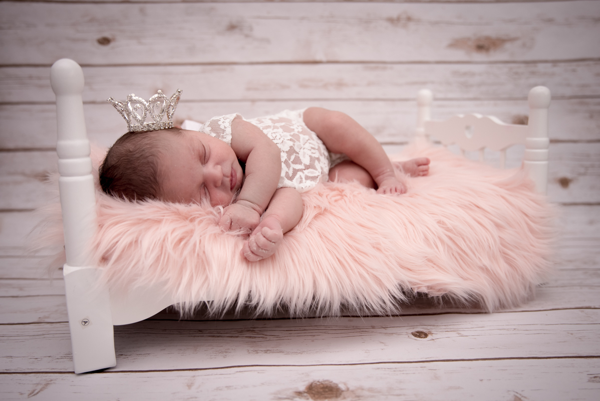 Girl newborn pink background