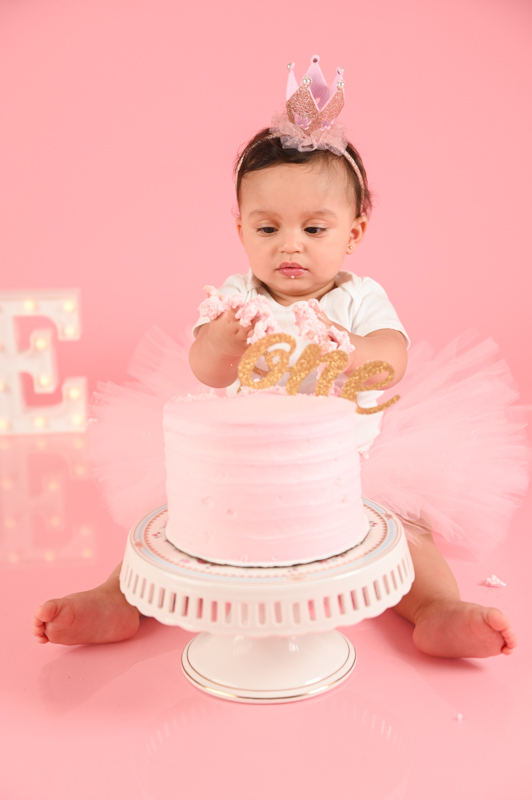 ballerina girl smash cake photo shoot solid pink background  little one 
kids photographer in CT
