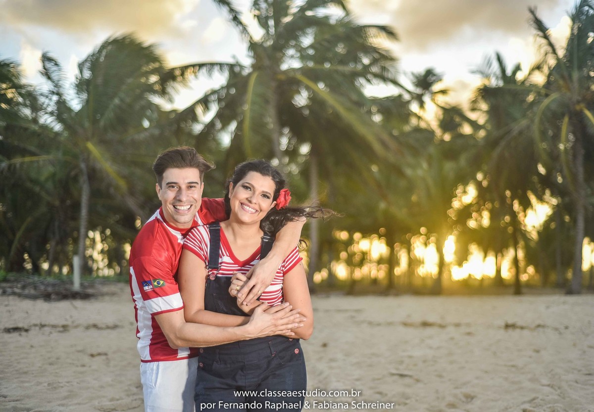 book de casal no por do sol