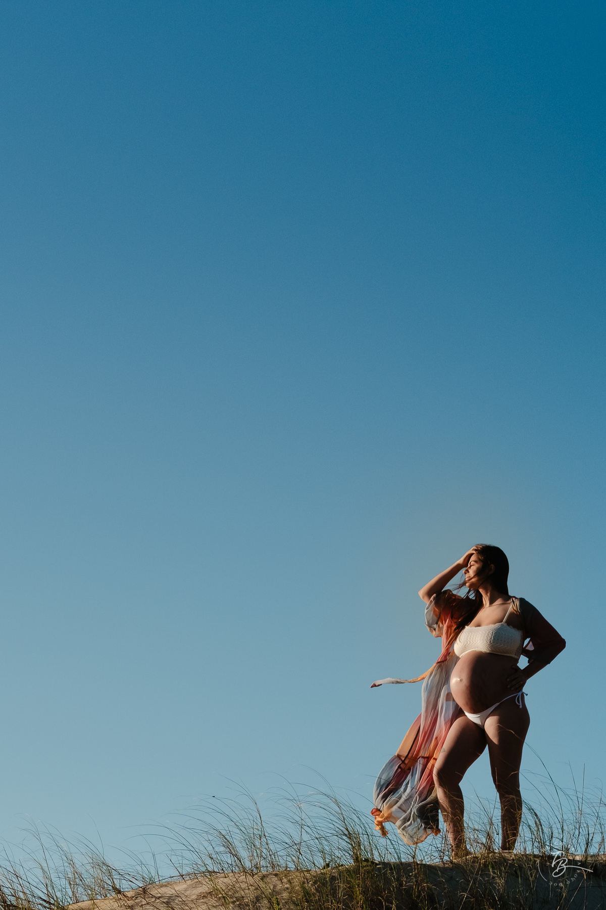 ensaio gestante no amanhecer na praia do campeche em Florianópolis, por Thiago Braga Fotografia