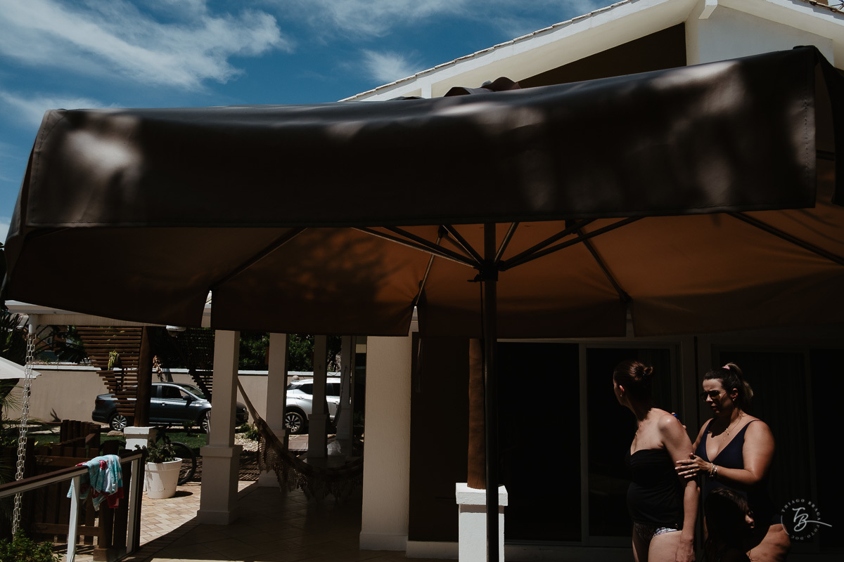 Fotografia documental de família, na praia de Mariscal, em Bombinhas/SC. Fotografo Thiago Braga. 