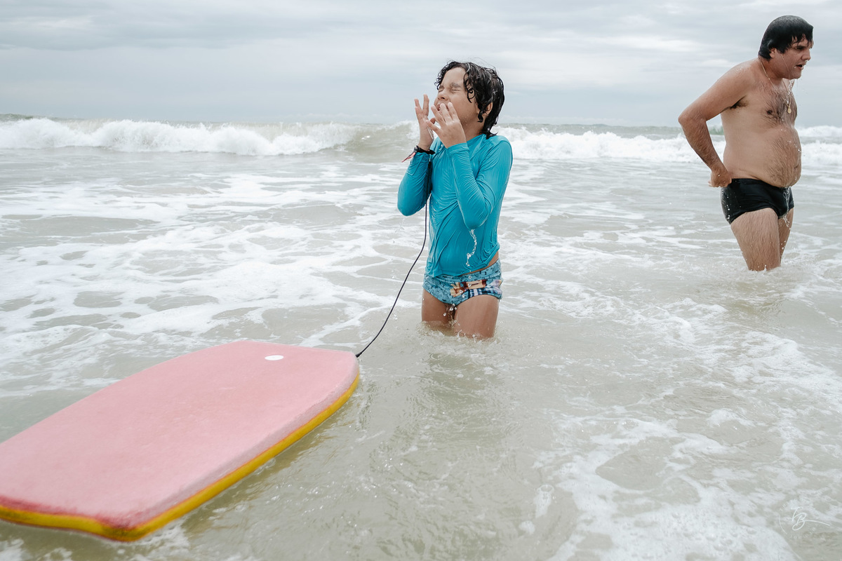 Fotografia documental da família Barbosa, na cidade de Bombinhas/SC. Fotos de um de férias por Thiago Braga.