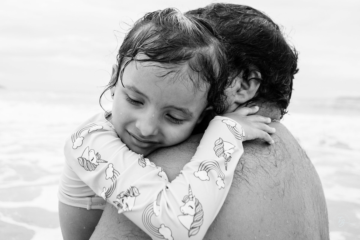 Fotografia documental da família Barbosa, na cidade de Bombinhas/SC. Fotos de um de férias por Thiago Braga.