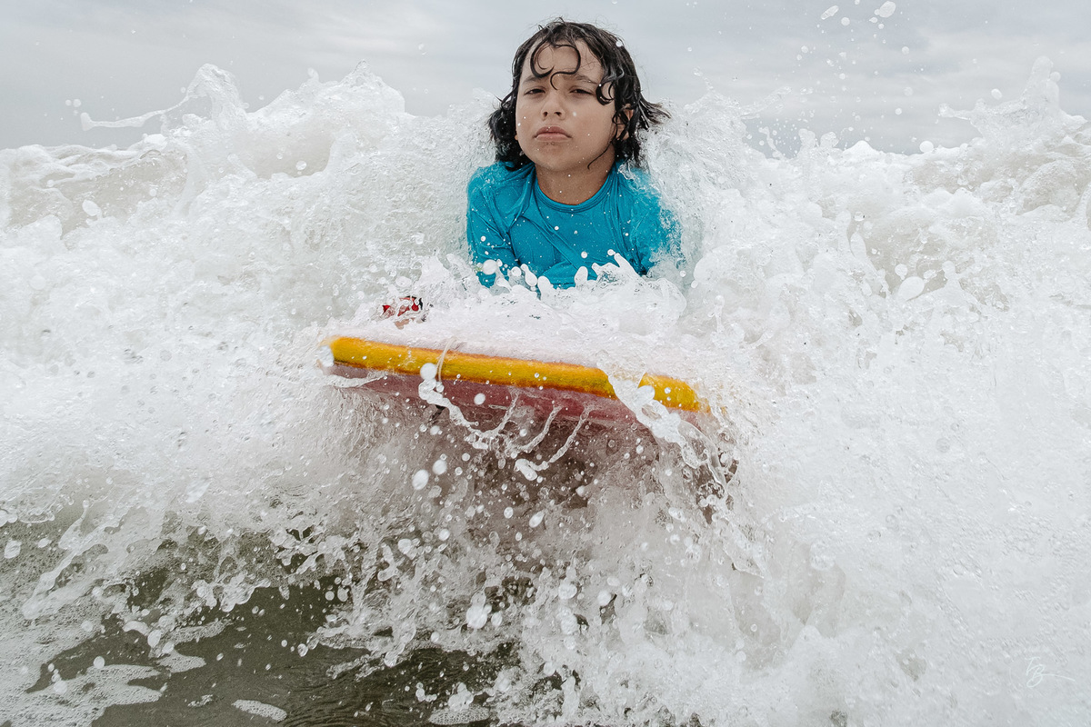 Fotografia documental da família Barbosa, na cidade de Bombinhas/SC. Fotos de um de férias por Thiago Braga.