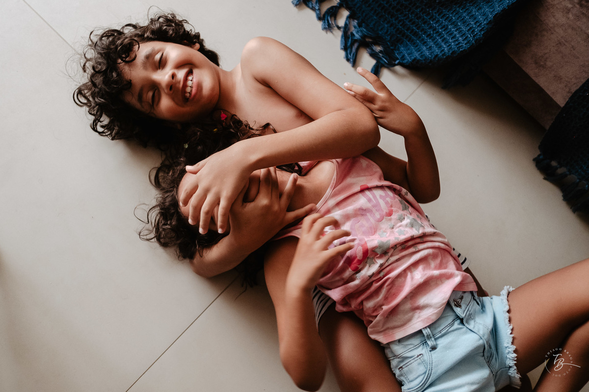 Fotografia documental da família Barbosa, na cidade de Bombinhas/SC. Fotos de um de férias por Thiago Braga.