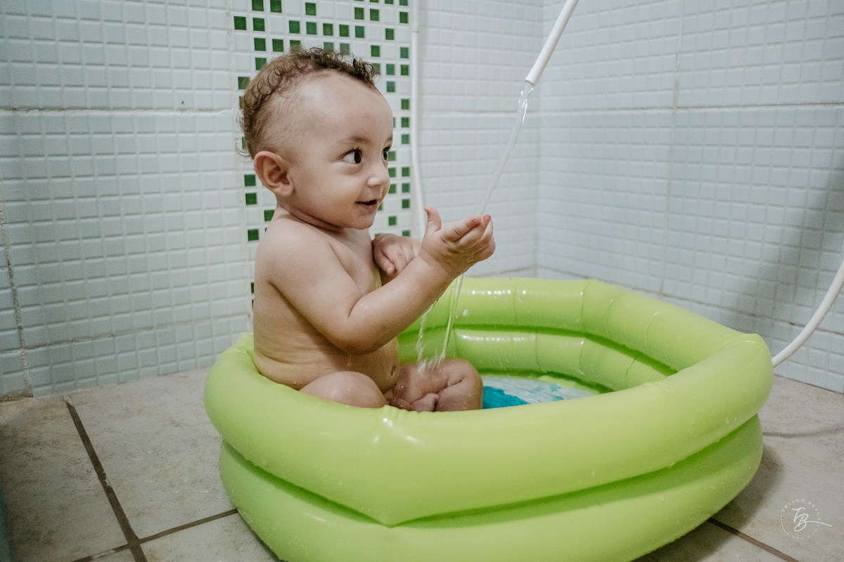 Fotografia Documental do Dia do Batizado do Davi, nos Ingleses em Florianópolis, por Thiago Braga fotografia