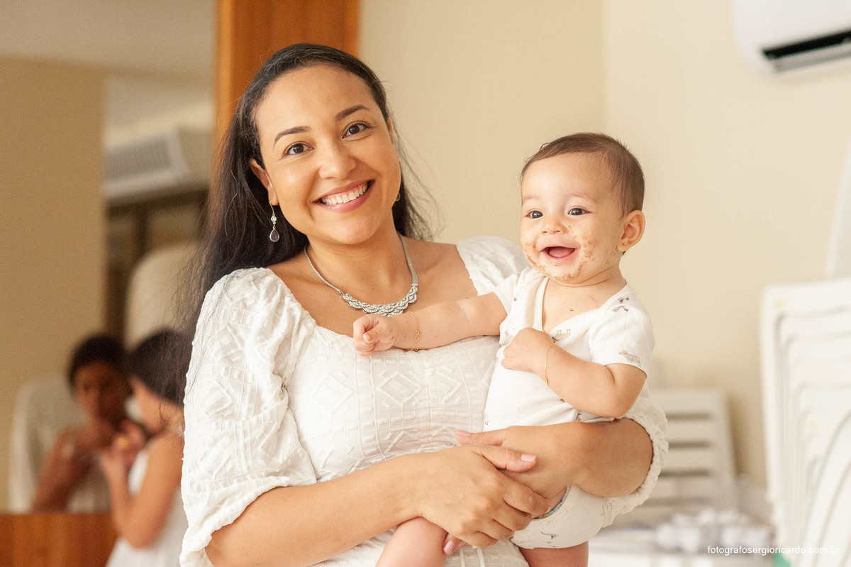 Foto da mãe com filha batizada