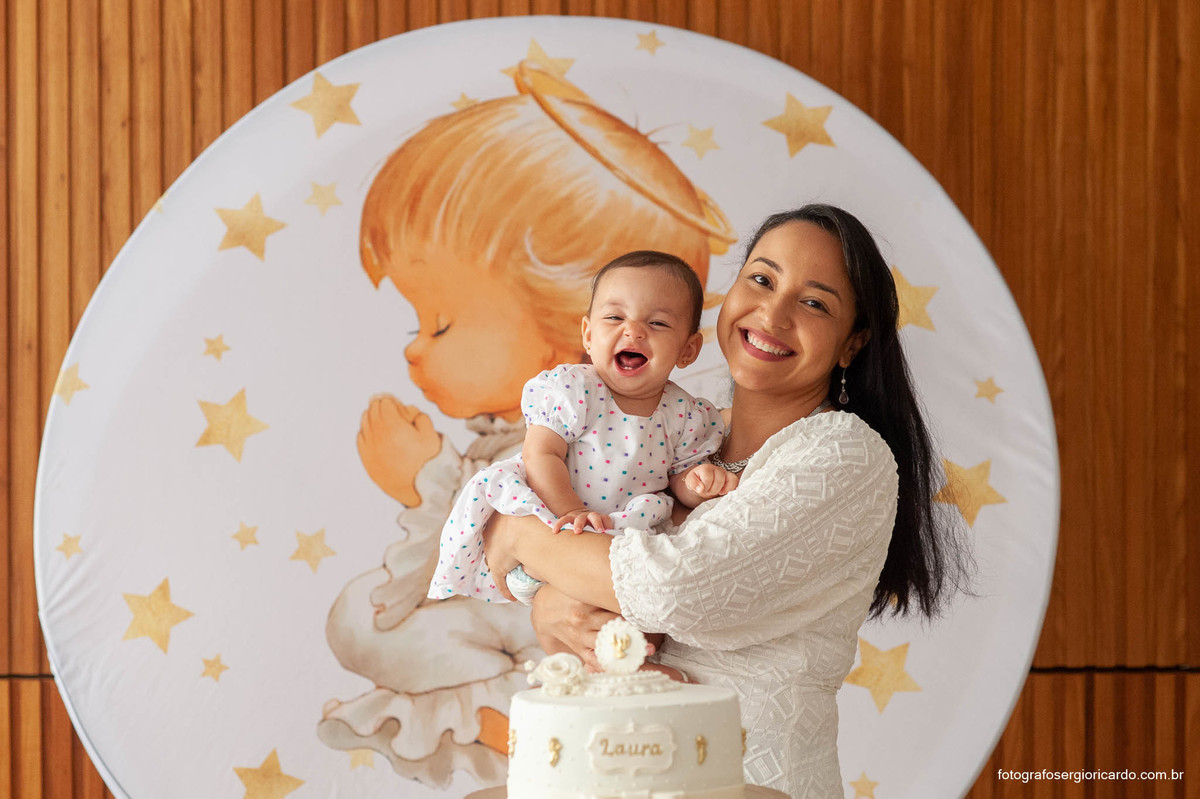 Foto da mãe com filha batizada