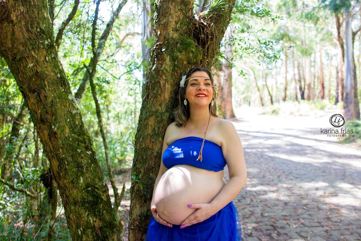 A felicidade da gestante em suas fotos de gravidez.