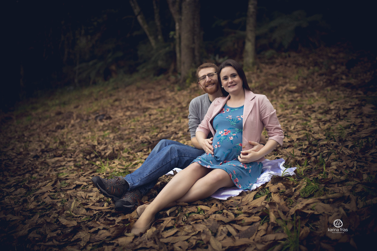 os pais posam para as fotos de gestante