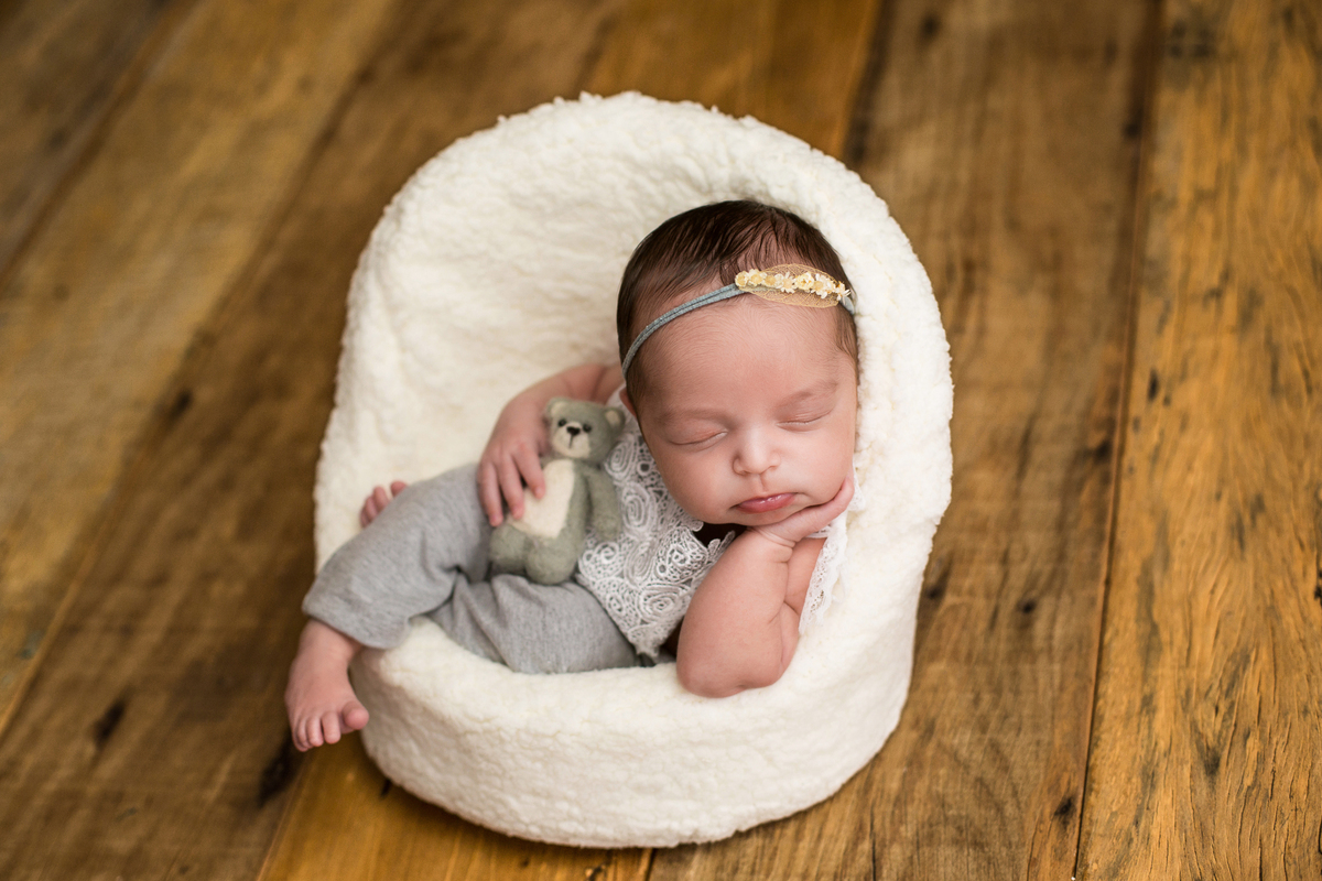 newborn on props wood