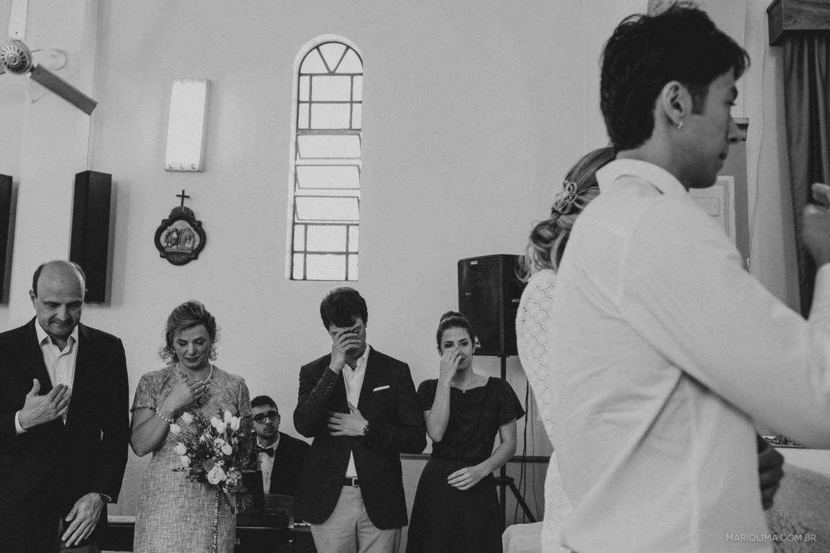 Padrinhos se benzendo em Paróquia São Roque