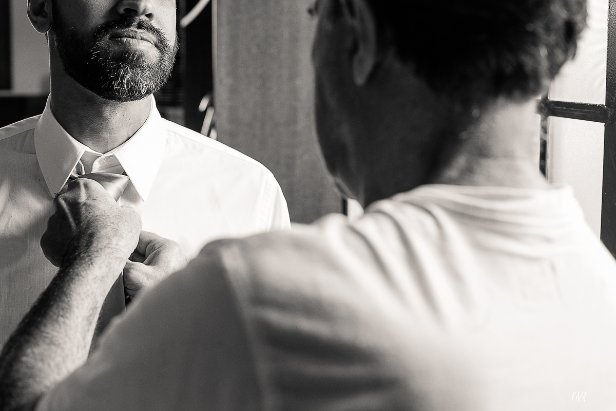 Fotografia dia do noivo pai e filho